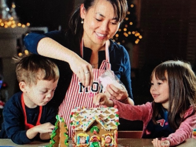 woman and children making gingerbread