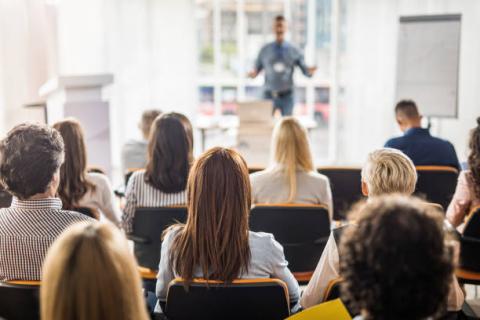 Image of a group of people at a presentation.